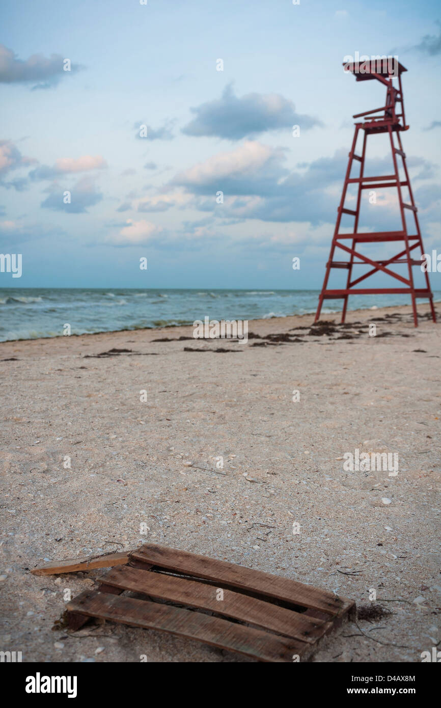 A red lifeguard chair and at the beach in Progreso, Yucatán Stock Photo