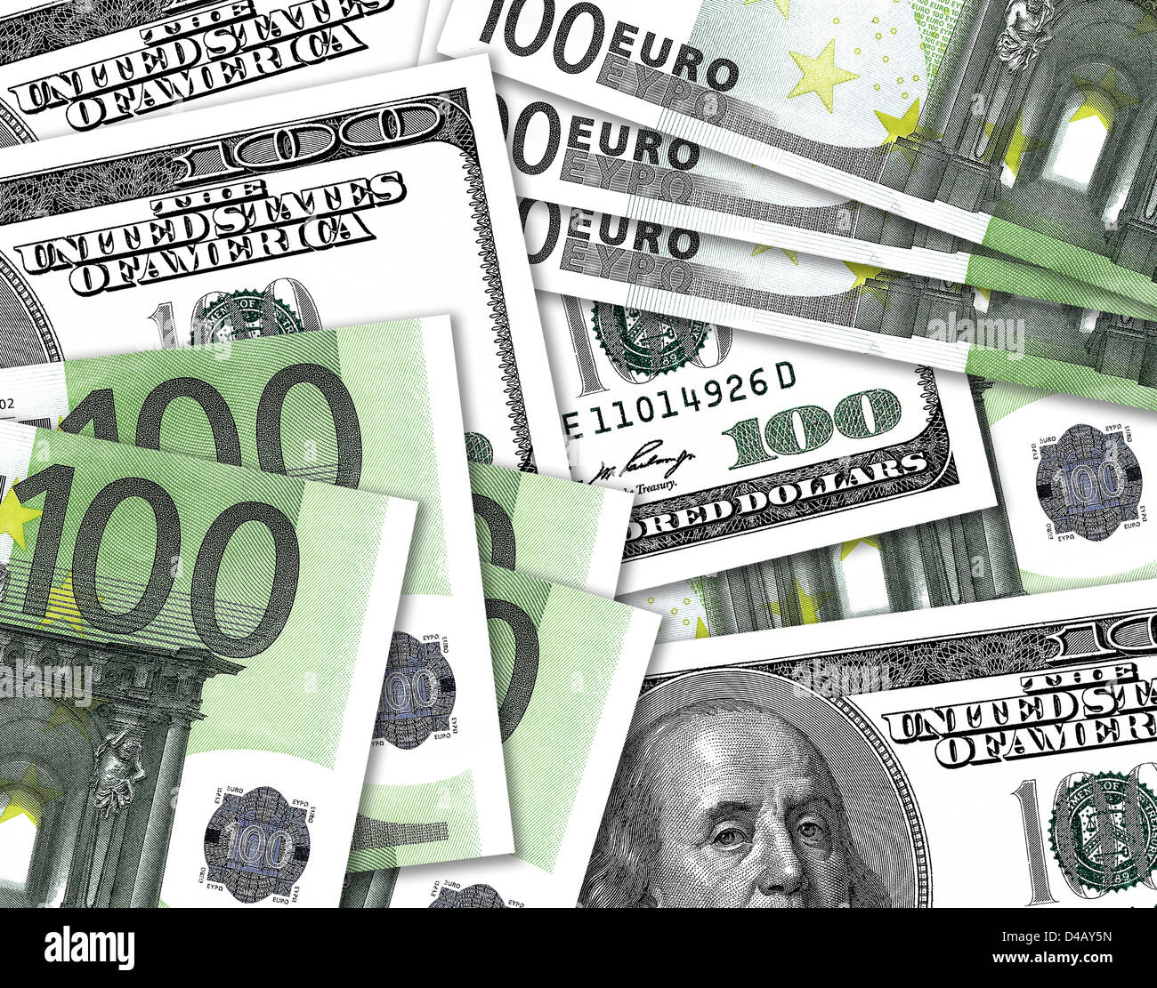 Hundred Dollar notes overlaping hundred Euro notes. $100 and €100 currency bills. Stock Photo