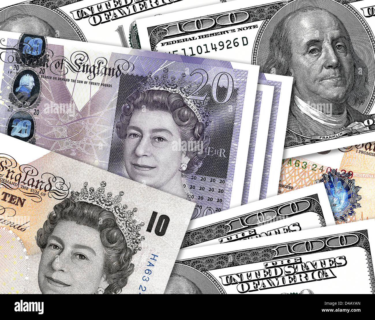 Ten and twenty pound notes overlaping hundred Dollar notes. £10, £20 & $100 currency bills. Stock Photo