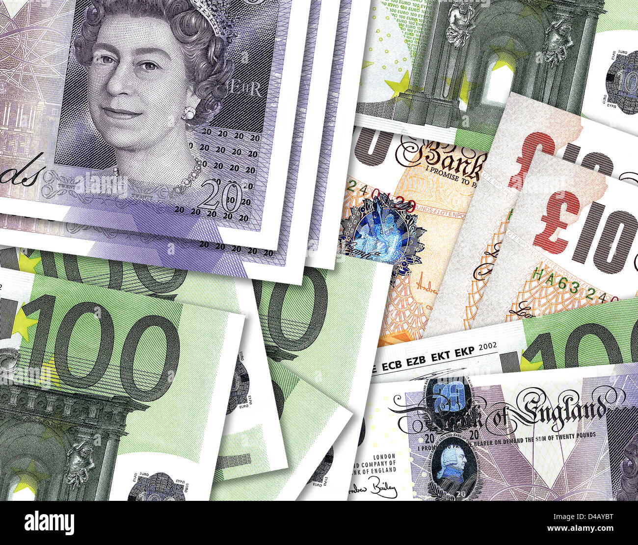 Ten and twenty pound notes overlaping hundred Euro money. £10, £20 & €100 currency bills. Stock Photo
