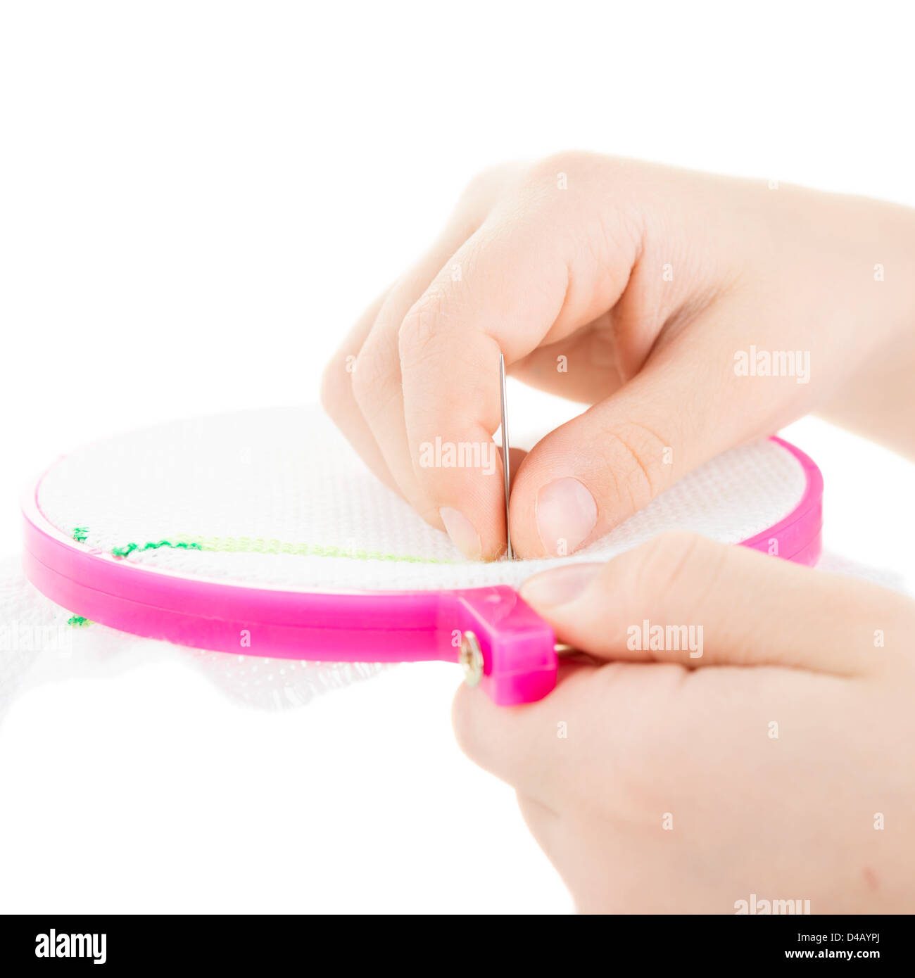 child hand embroiders with a needle and a thread Stock Photo - Alamy