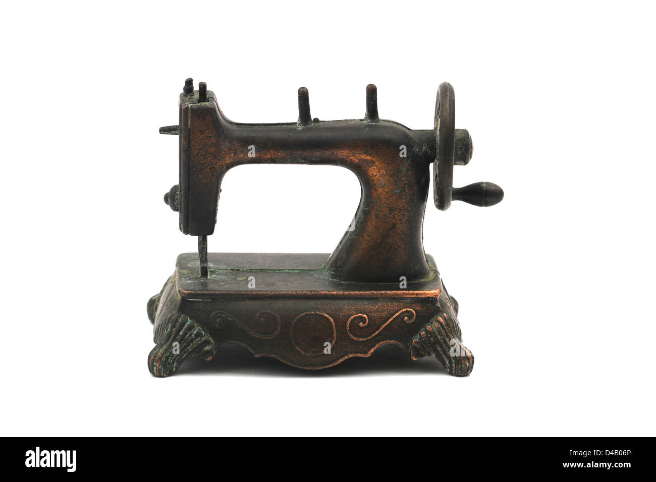 Brass vintage pencil sharpener in shape of sewing machine Stock Photo