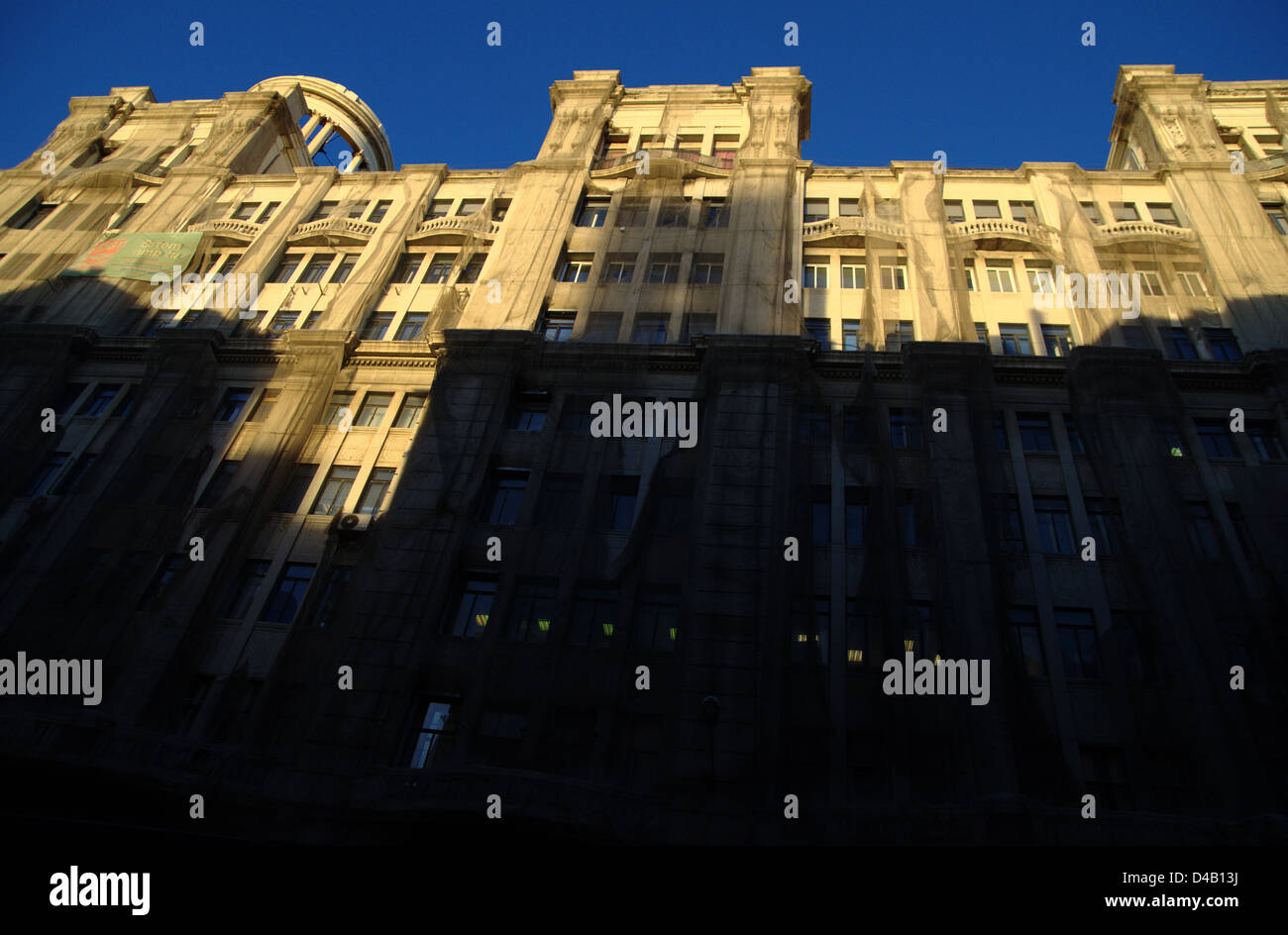 A building being in process of restoration in the Via Layetana of Barcelona at evening, with shadows Stock Photo