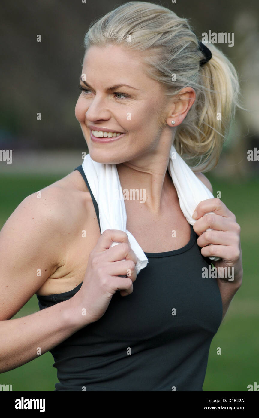 Woman exercising in the park Stock Photo - Alamy