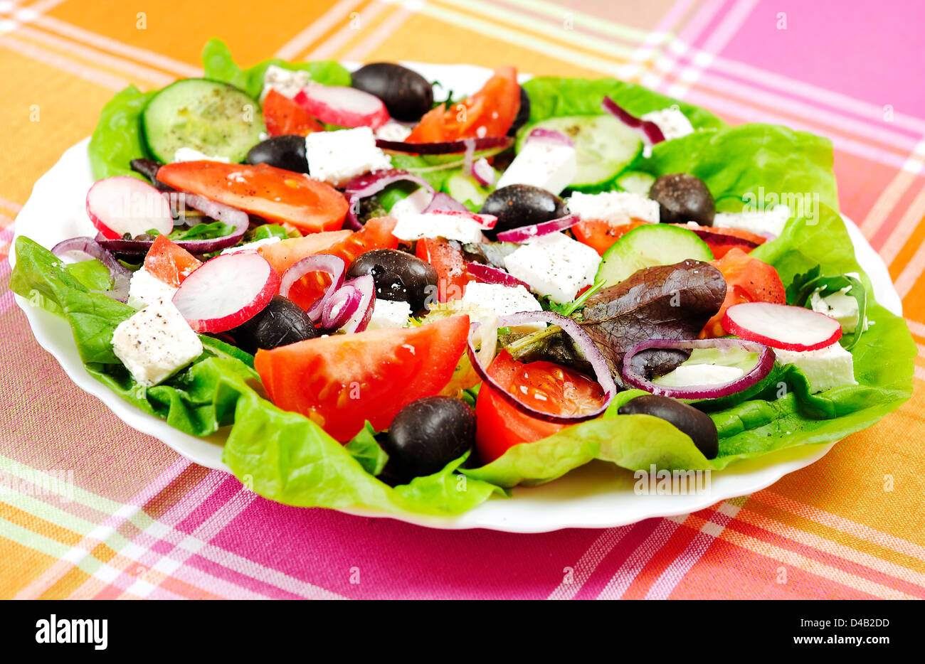 Fresh salad on kitchen table Stock Photo