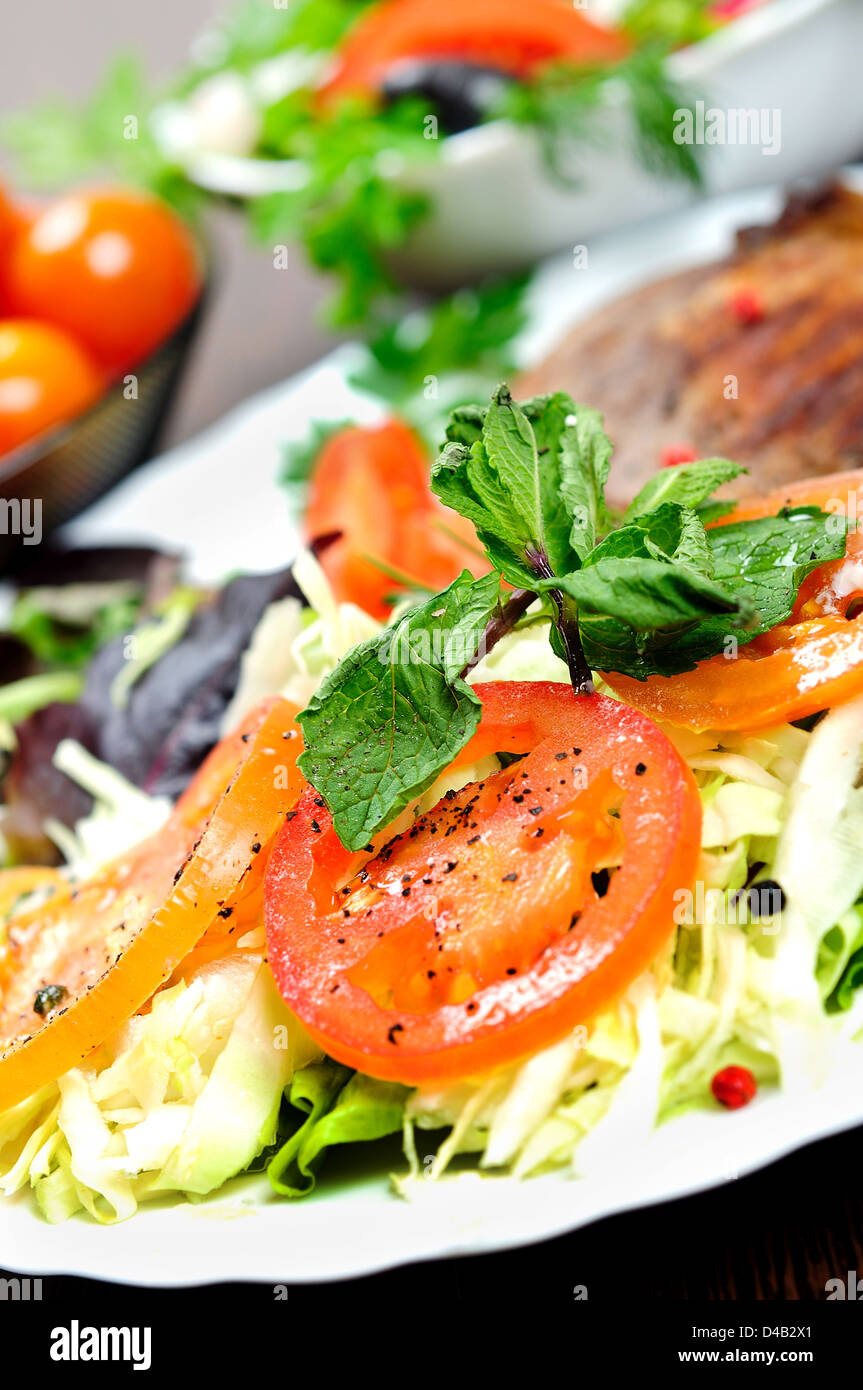 Plate with grilled meat and salad Stock Photo