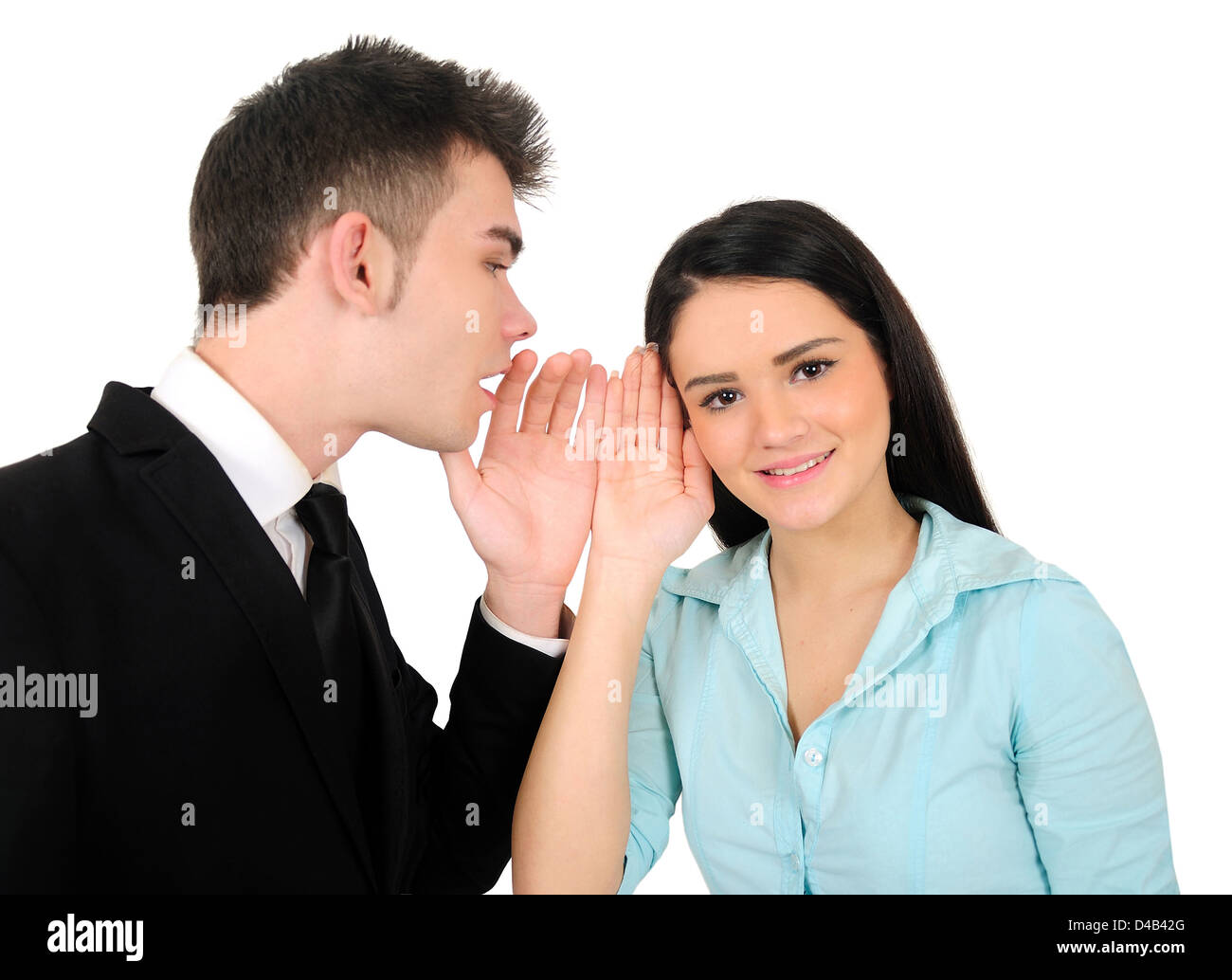Isolated young business couple whispering Stock Photo