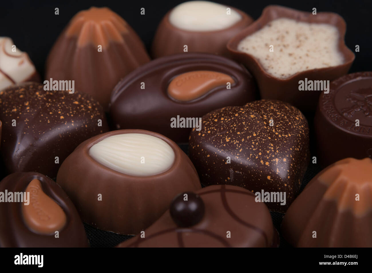 close up photo of chocolates isolated on a black background Stock