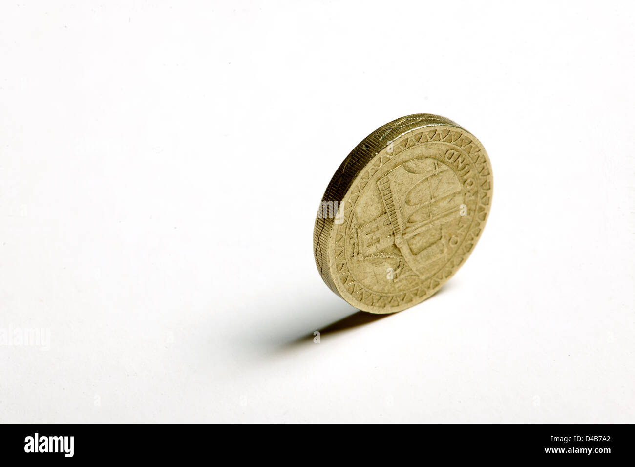 A British pound coin balanced on its rim Stock Photo Alamy