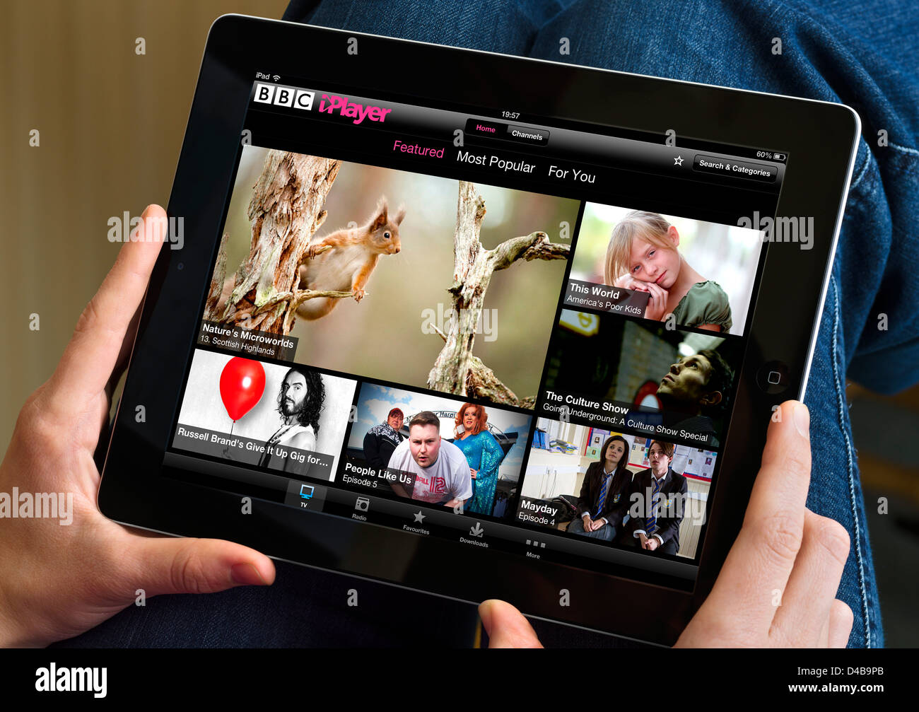 Watching TV via BBC iPlayer on an Apple iPad Stock Photo