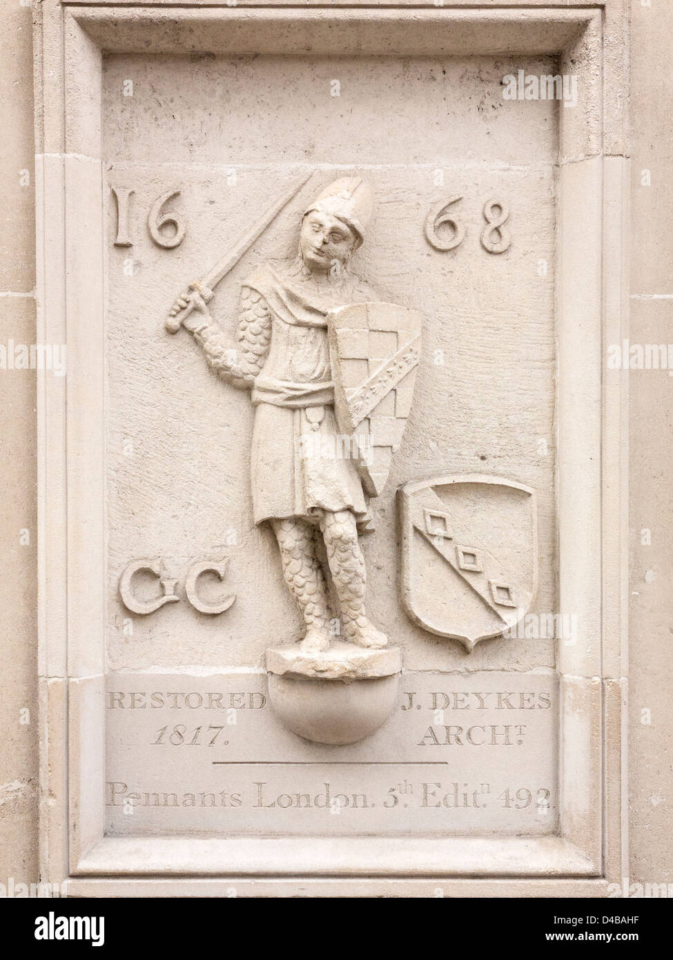 Stone plaque carving of soldier with date 1668 on the Axa insurance building in London, England Stock Photo