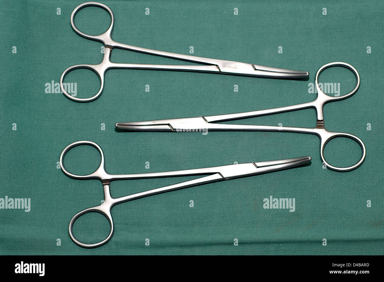 Artery forceps for grasping and compressing an artery. Stock Photo