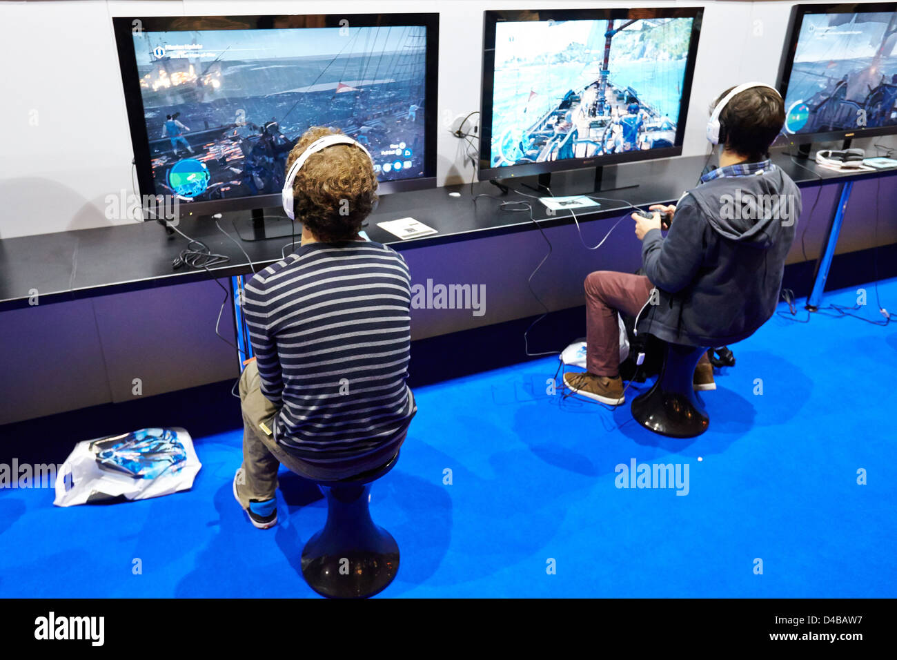 Visitors try out an unreleased computer game at the Eurogamer Expo in Earls Court London Stock Photo