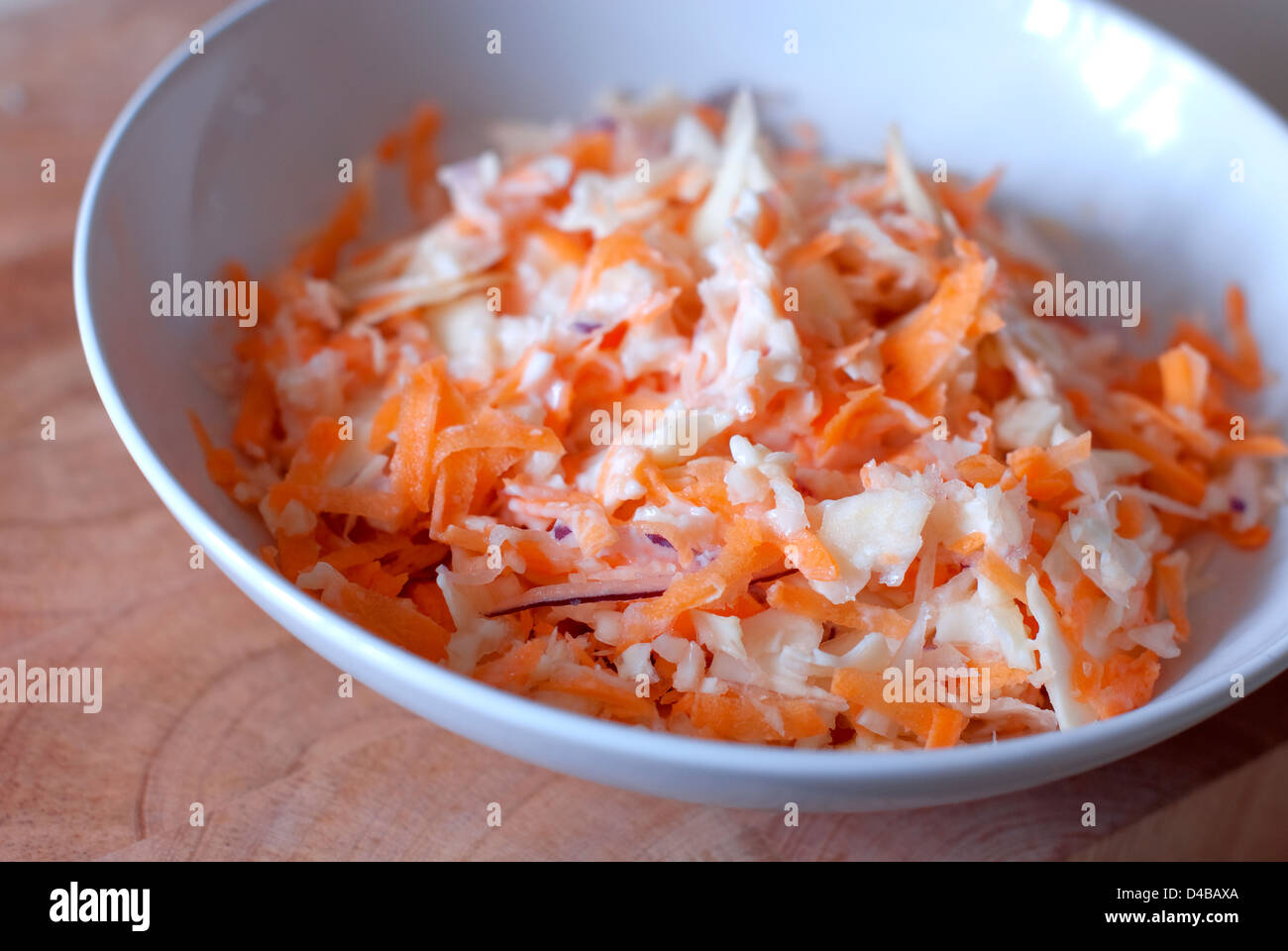 Still life Food image of a white bowl filled with home made coleslaw Stock Photo