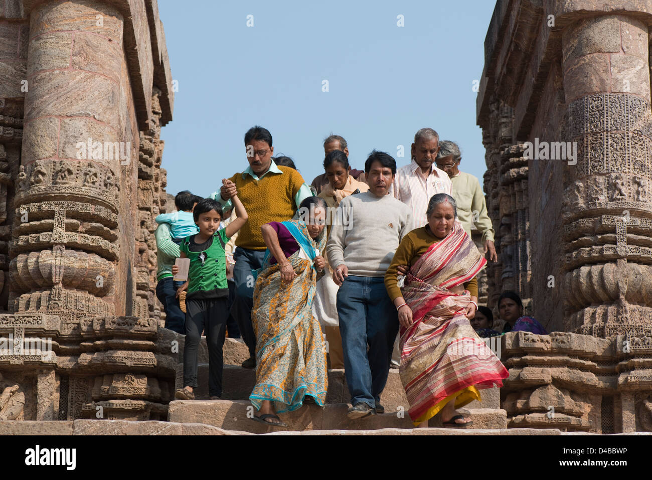 A group of tourists descend steps at the Konark Sun Temple near Puri, Odisha state, India Stock Photo
