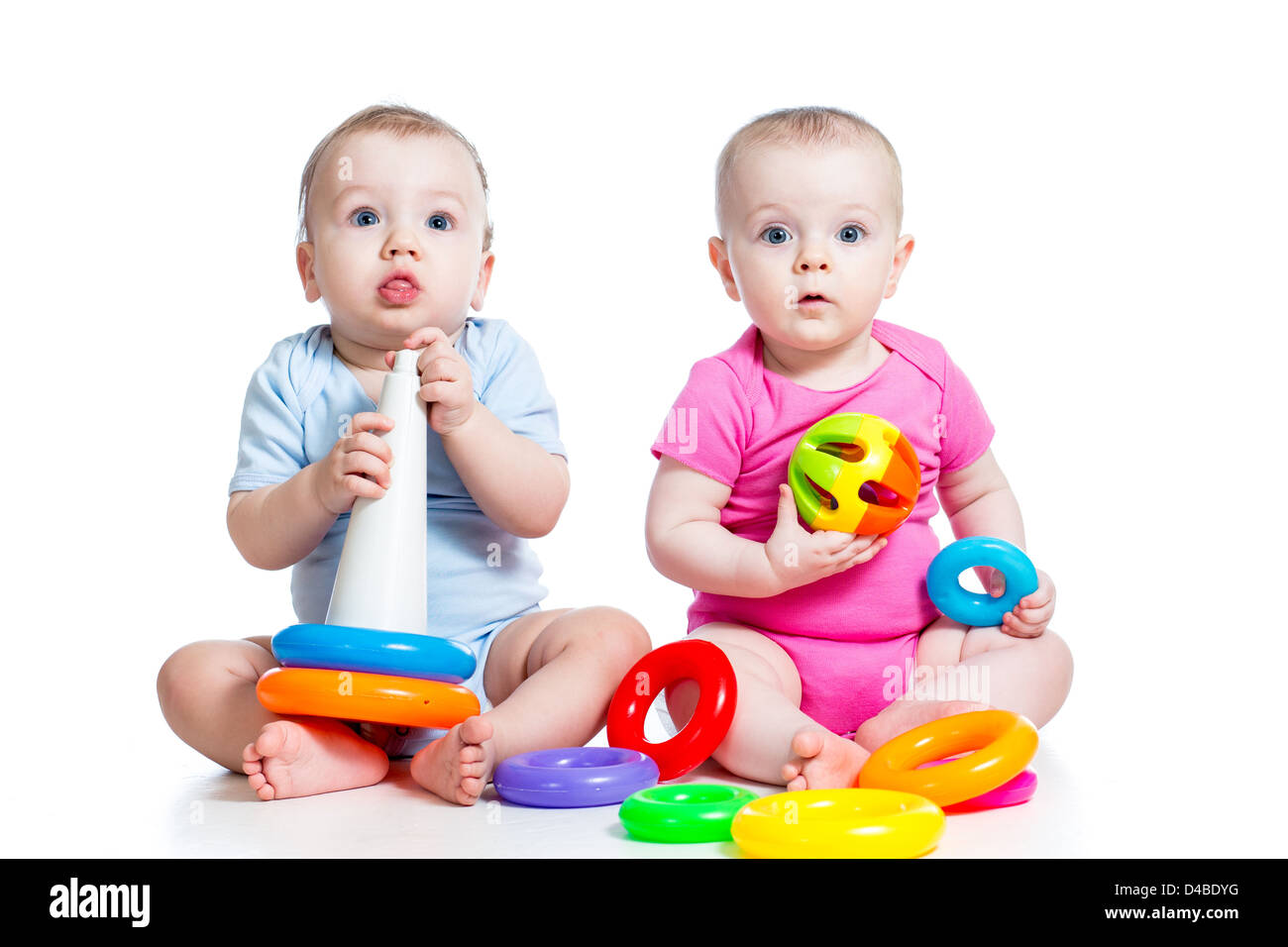 kids boy and girl playing toys together Stock Photo