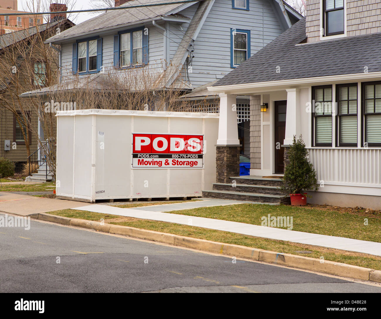ARLINGTON, VIRGINIA, USA - PODS storage container in front of houses. Stock Photo