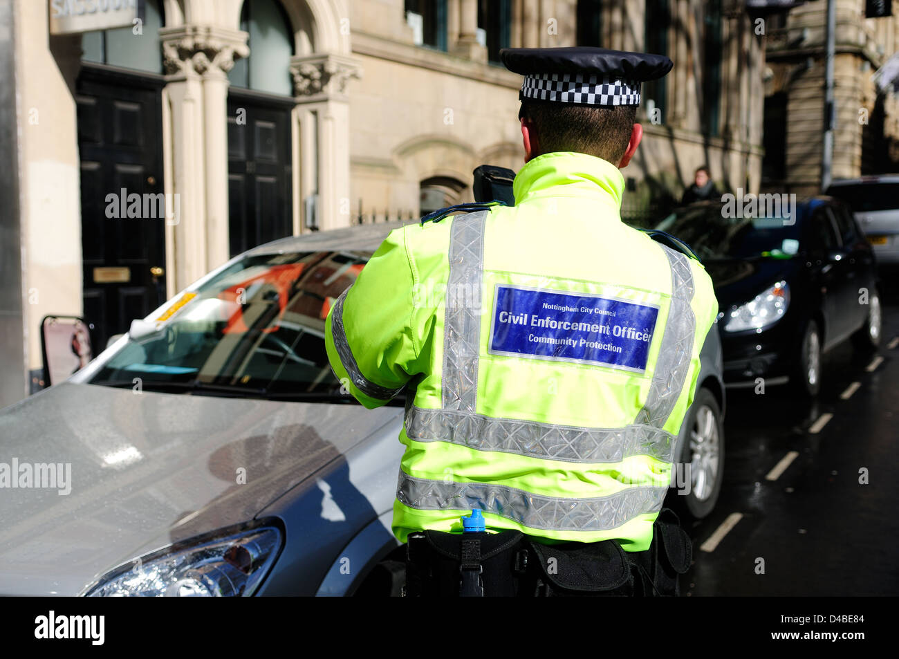 Penalty Charge Notice.Civil Enforcement Officer,Taking Photo. Stock Photo