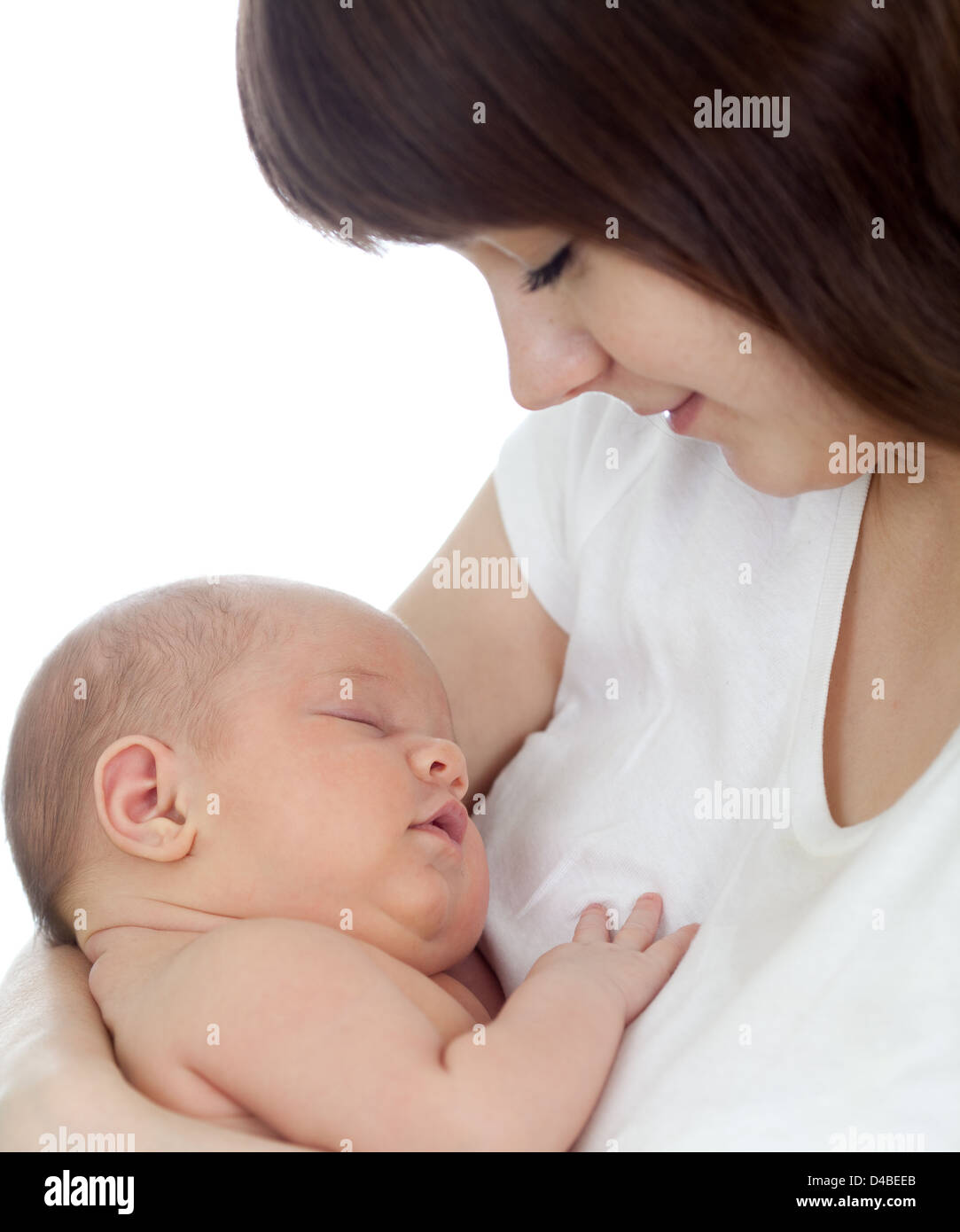 Close-up young mother holding her newborn baby isolated on white background. Focus on child. Stock Photo