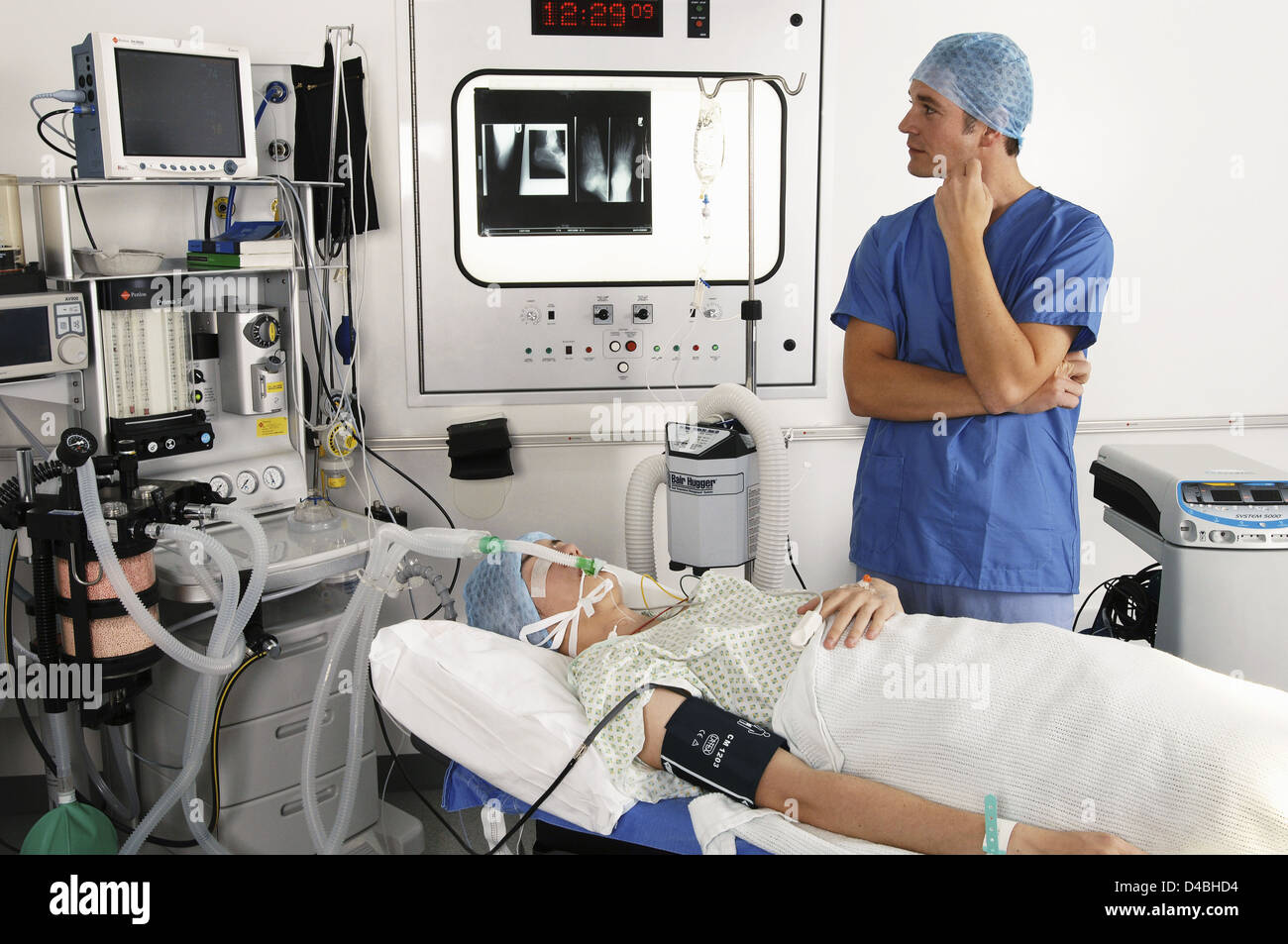 Anesthetist monitoring data on computer screen during operation Stock ...