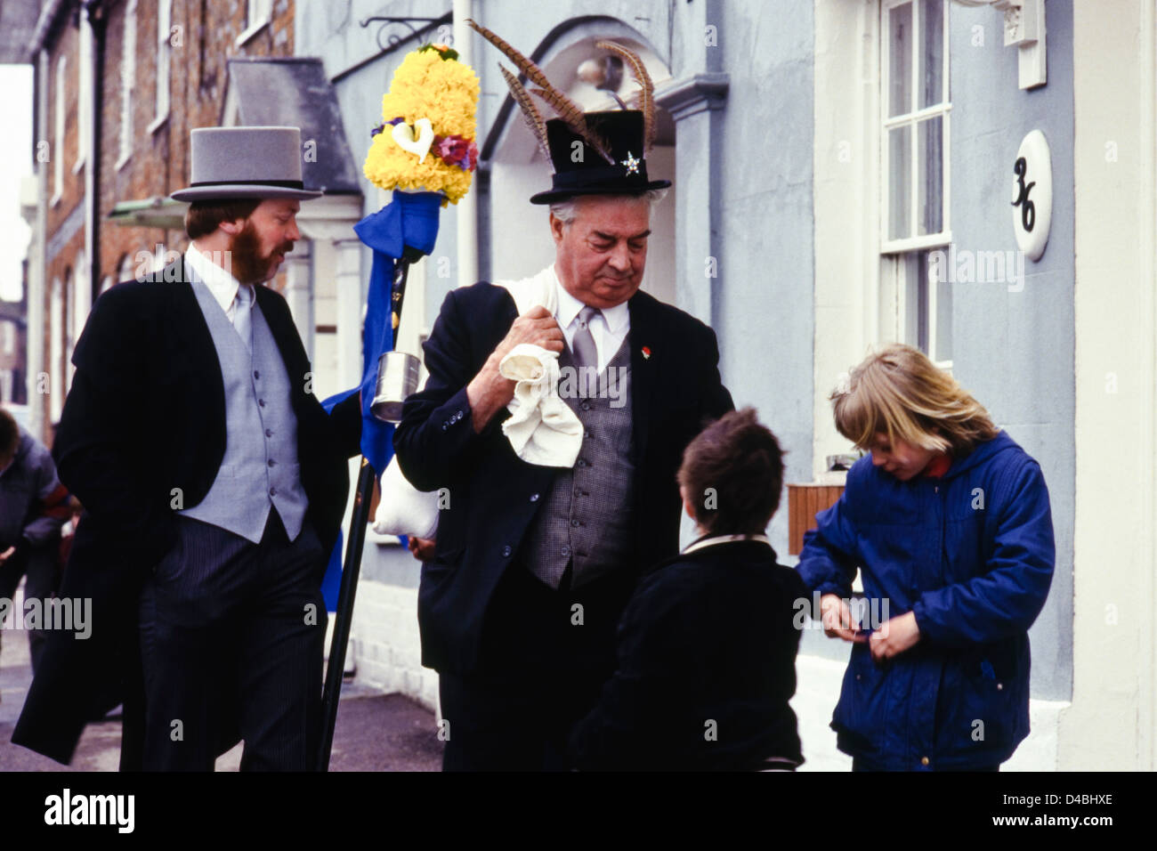 Children waiting for money in the path of the Tuttimen & Orangeman Hocktide Ceremony annual custom celebrated at Hungerford Berkshire England UK Stock Photo