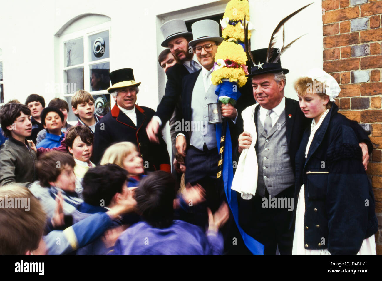 A pathway is made through group of children for the Tuttimen & Orangeman by scattering money Hocktide Ceremony annual custom celebrated at Hungerford Berkshire England UK Stock Photo