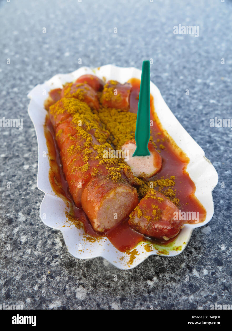 Currywurst - Bratwurst German sliced sausage dish with ketchup and curry Stock Photo