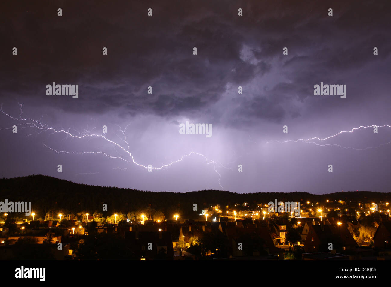 Lightnings in the night sky over the city Stock Photo - Alamy