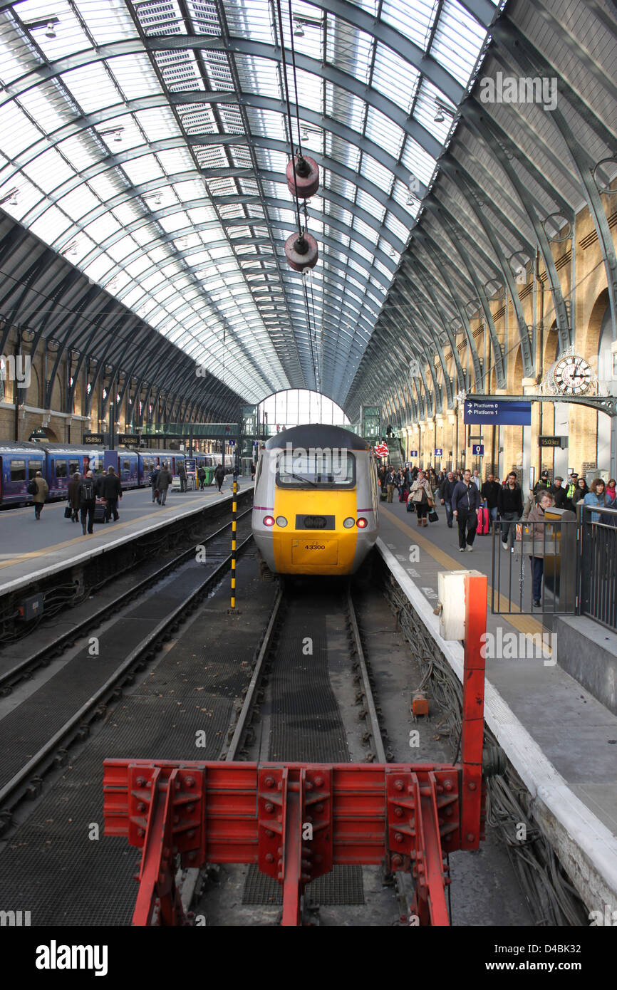 Passengers leaving East Coast High Speed Train at Kings Cross station, London, just arrived from Aberdeen. Stock Photo