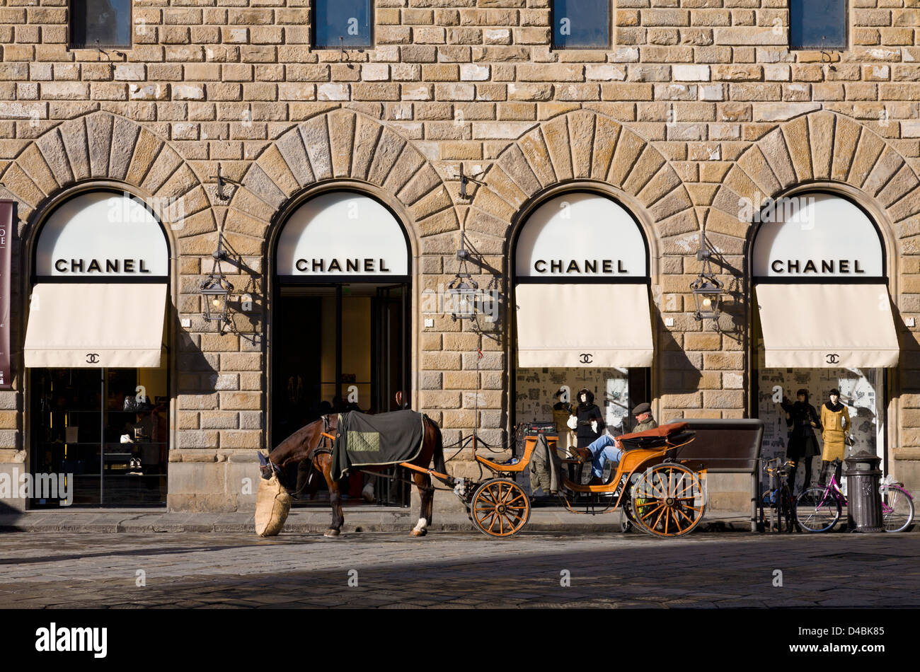 Horse drawn carriage awaiting customers outside the Chanel store in the  Piazza della Signoria, Florence, Italy Stock Photo - Alamy