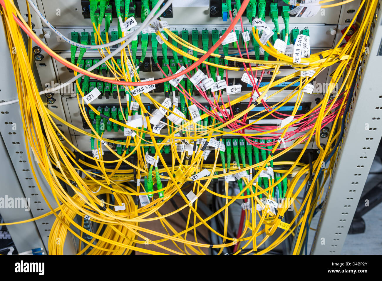 server with fiber optic cables in data center Stock Photo
