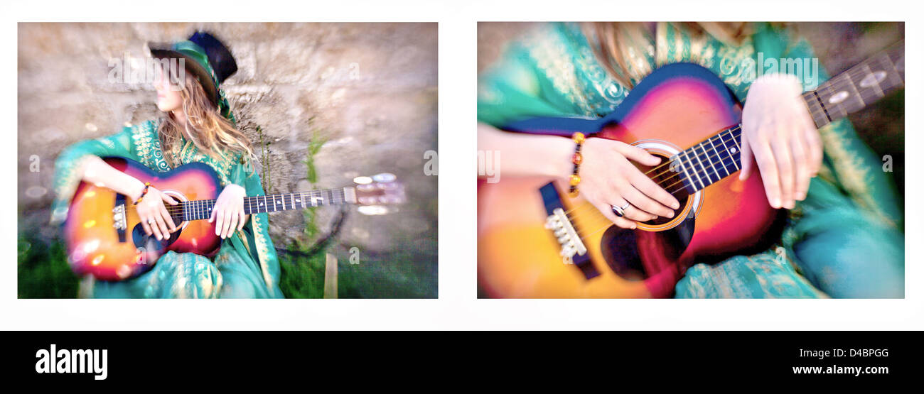 A white European female age 20-25 wearing hippie style clothing and playing a guitar, the image was shot on location in the UK. Stock Photo