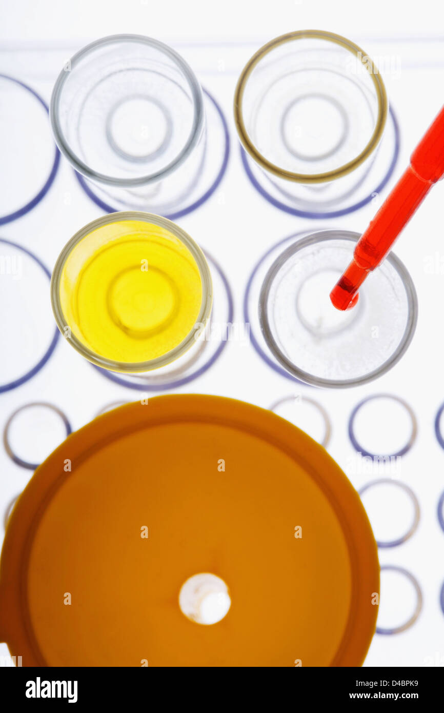 Pipetting red liquid into test tubes Stock Photo - Alamy