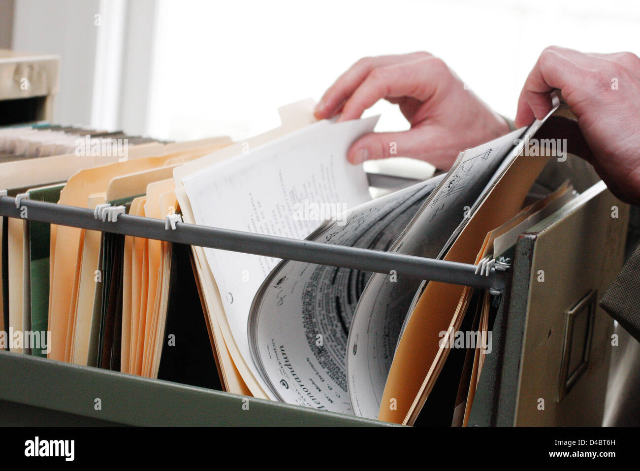 Searching through paperwork in a filing cabinet Stock Photo Alamy Searching through paperwork in a filing cabinet Stock Photo Alamy