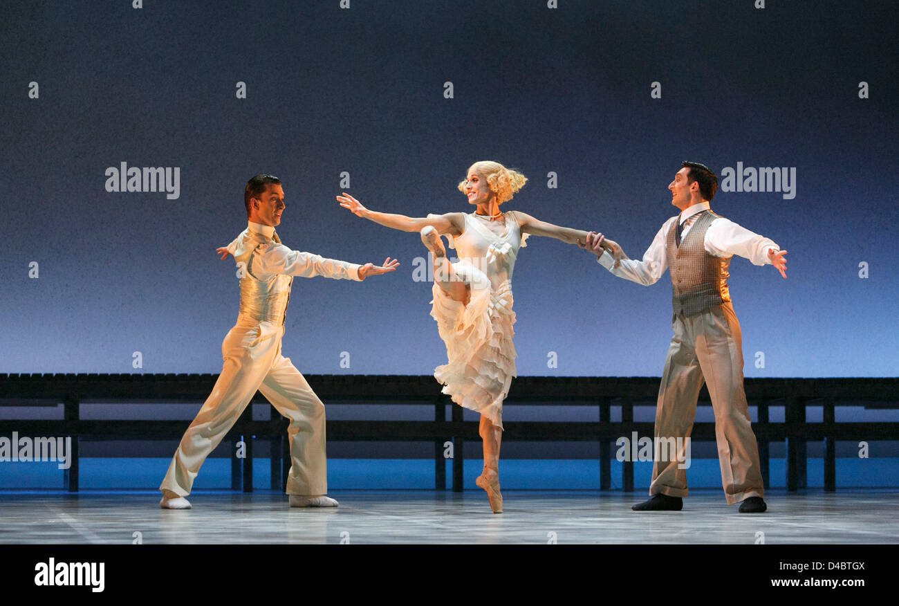 l-r: Tobias Batley (Jay Gatsby), Hannah Bateman (Jordan Baker), Giuliano Contadini (Nick Carraway) in THE GREAT GATSBY presented by Northern Ballet at the Grand Theatre, Leeds, England in 2013 based on the novel by F Scott Fitzgerald music: Richard Rodney Bennett set design: Jerome Kaplan costumes: David Nixon & Julie Anderson lighting: Tim Mitchell choreography & direction: David Nixon co-direction: Patricia Doyle Stock Photo