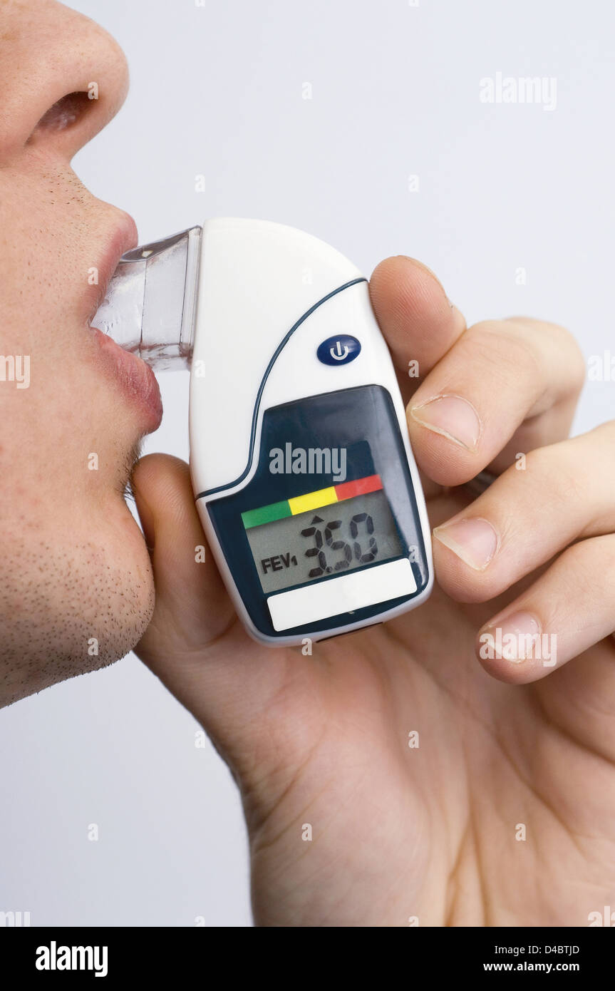 The digital peak flow meter measures patients maximum ability exhale average person should be able blow around 300-400 lp min Stock Photo