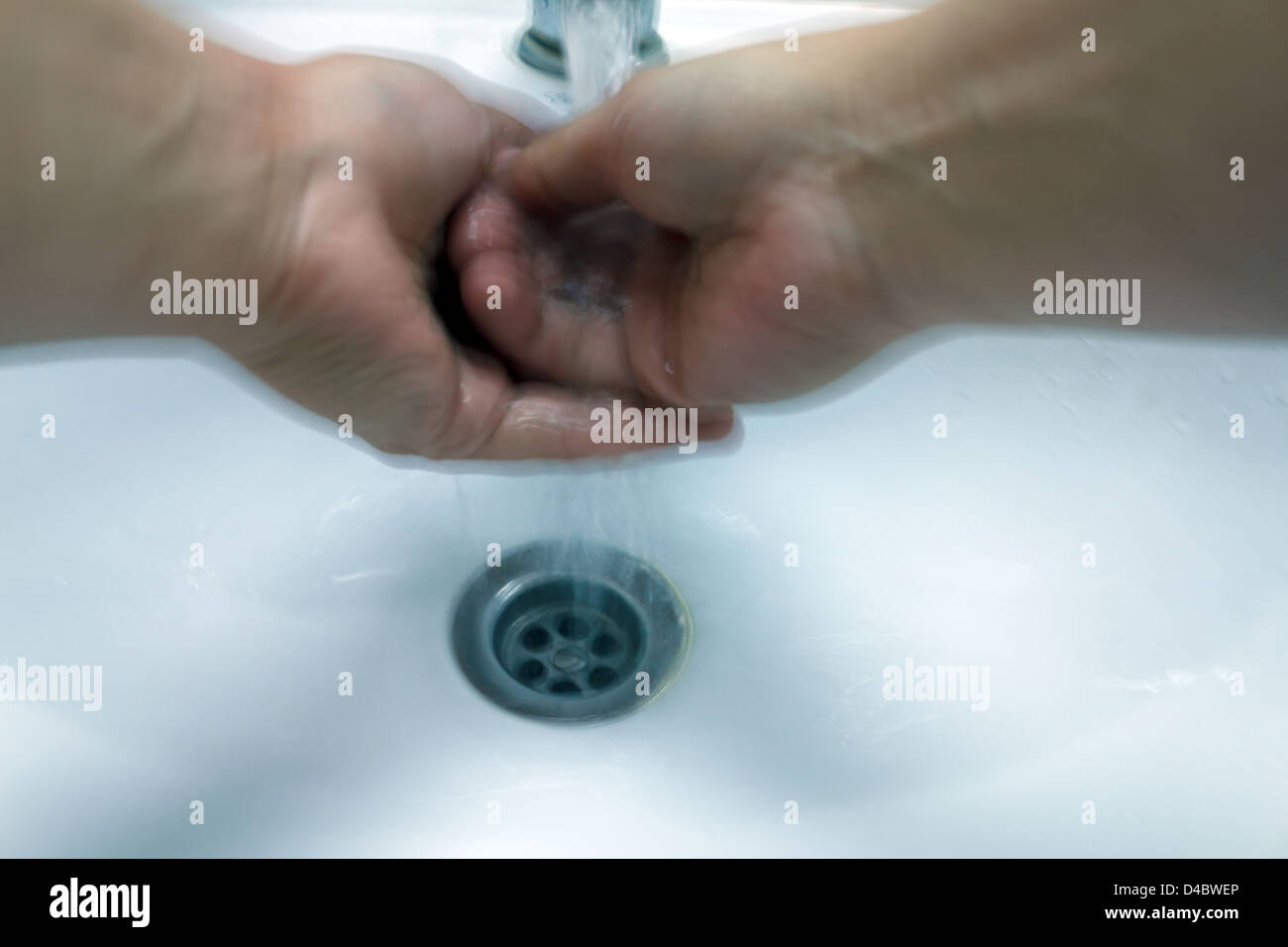 Kolobrzeg, Poland, a woman washes her hands thoroughly the Stock Photo