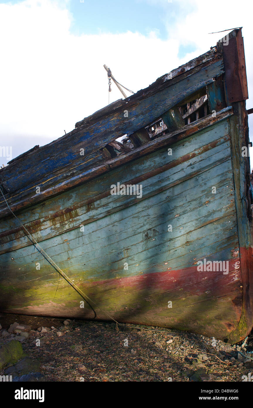 Rotting Boat Hull with colorful paint Stock Photo