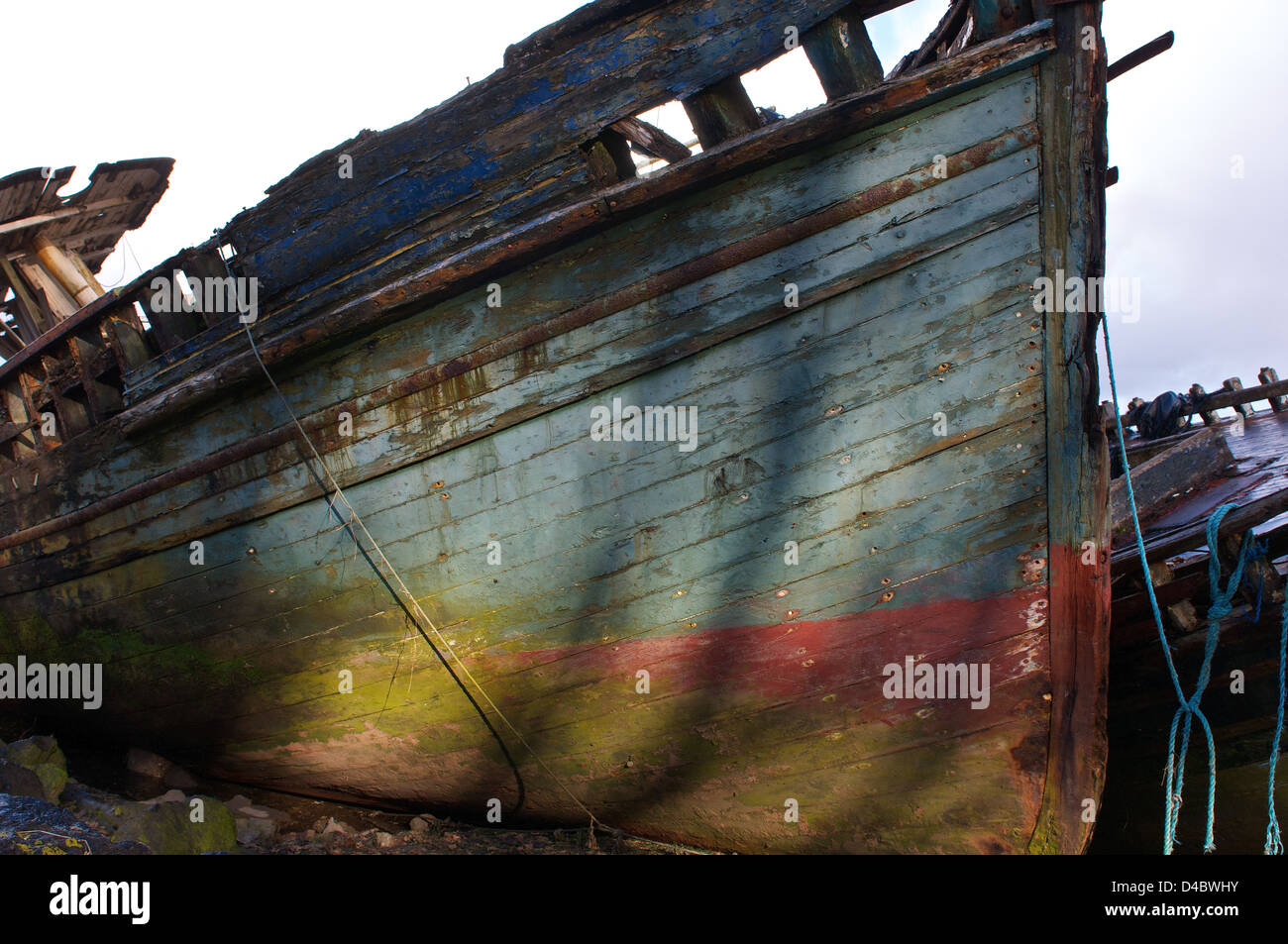 Rotting Boat Hull with colorful paint Stock Photo