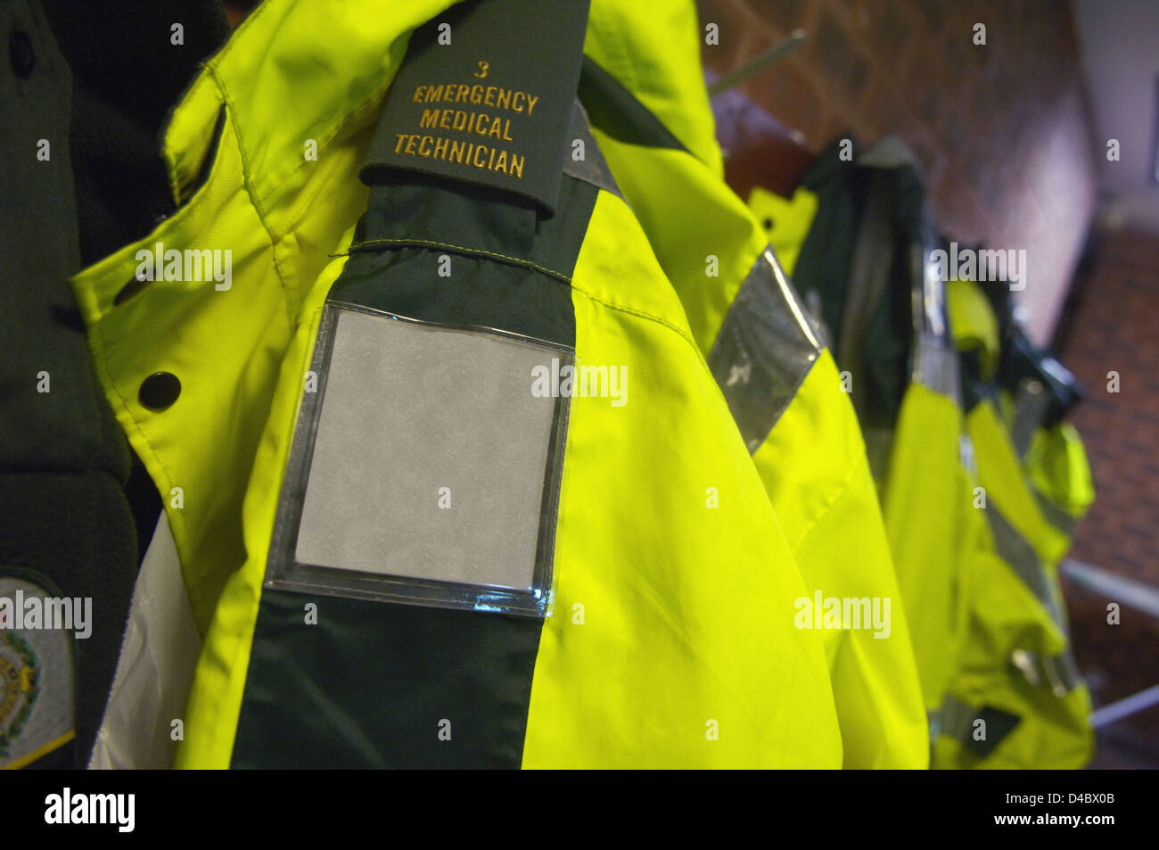 Close-up of ambulance crew fluorescent jackets Stock Photo