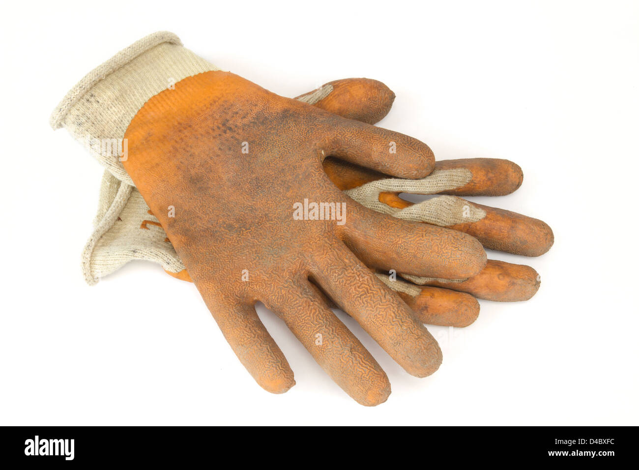 Pair of used and dirty gardening gloves on a white background Stock