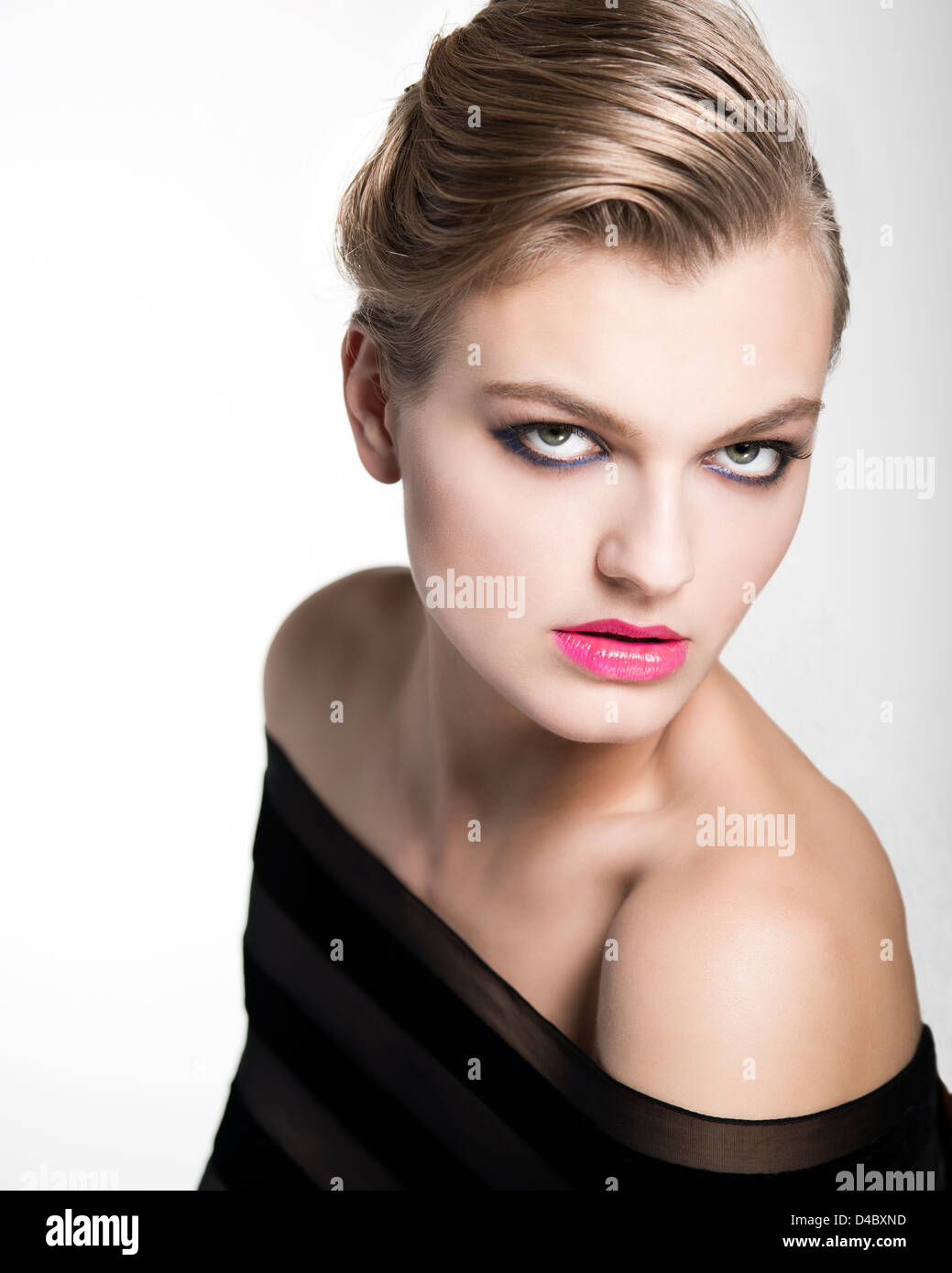 Beauty portrait of a young woman with blond hair and pink lipstick Stock Photo