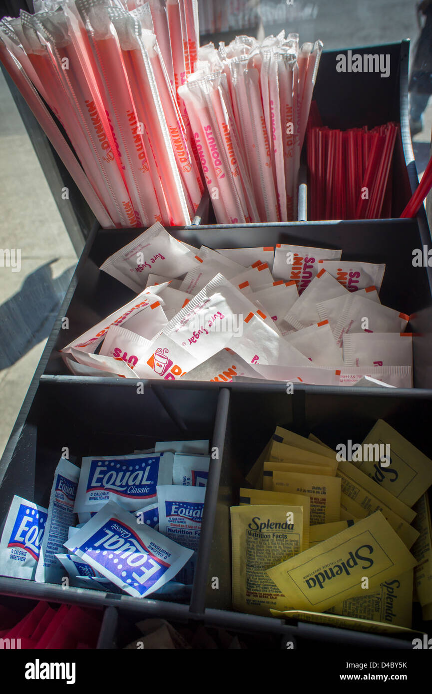 Packages of sugar and artificial sweeteners are seen in a Dunkin Donuts