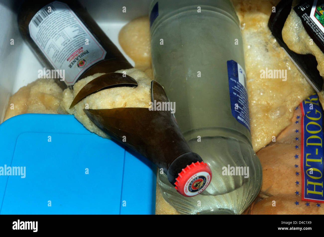 Bottle of beer shattered in the freezer - put in to cool down and forgotten  with tragic consequences Stock Photo - Alamy