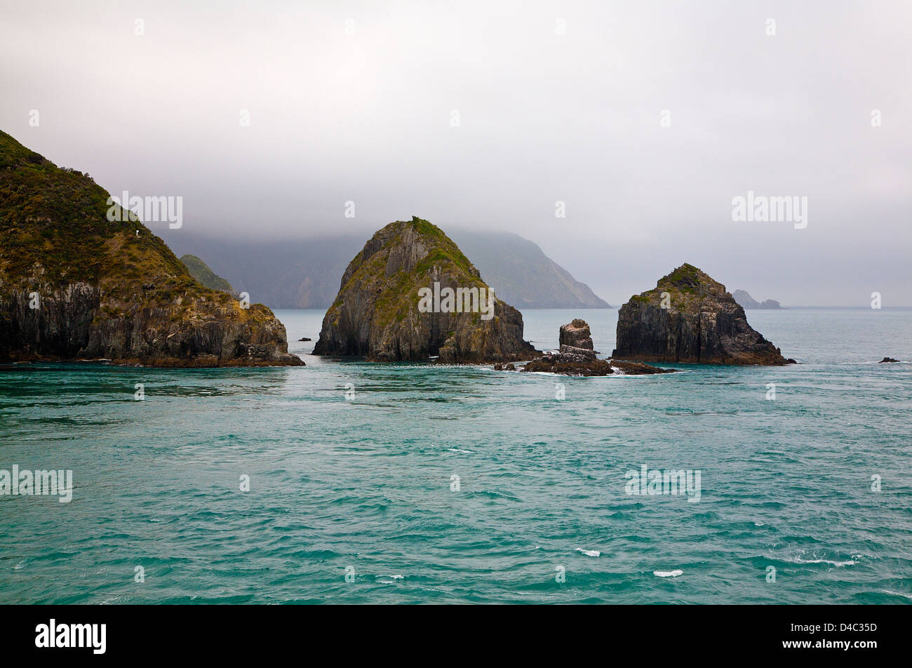 Atmospheric view of mist over rocks in Cook Strait between North and South islands, New Zealand. Stock Photo