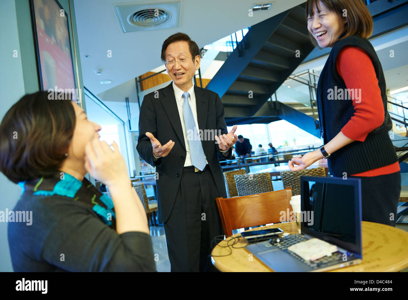 Jonney Shih, Chairman of ASUS, interacts with coworkers at Starbucks on campus of the ASUS Headquarters in Taiwan. Stock Photo