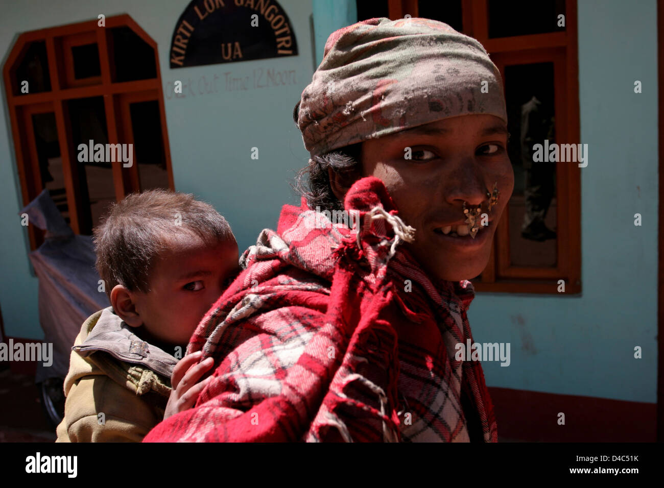 Garhwali tribal woman and child in Gangotri bazaar. Stock Photo