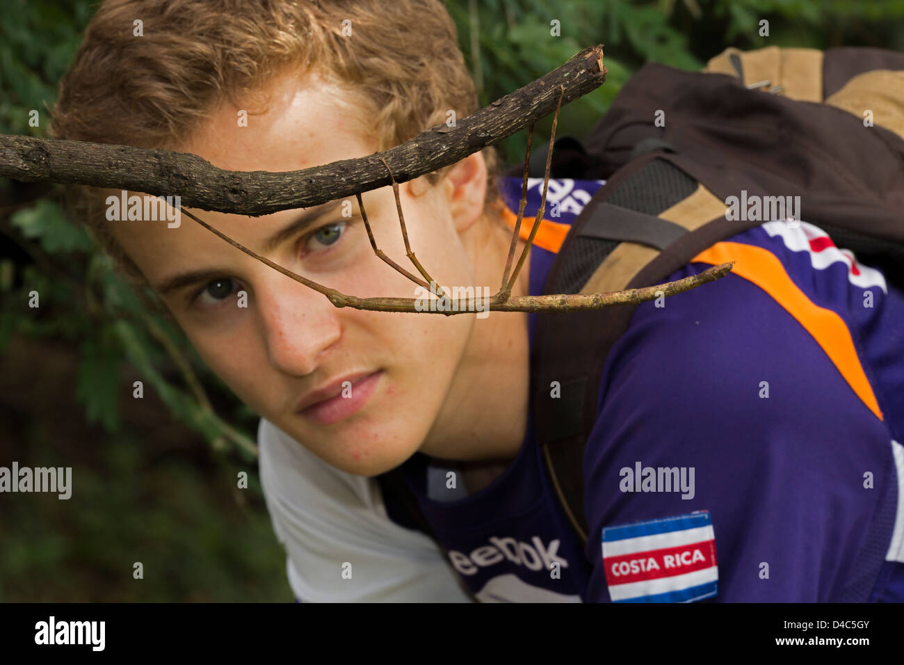 Boy and walking stick, tropical rainforest, Costa Rica Stock Photo Alamy