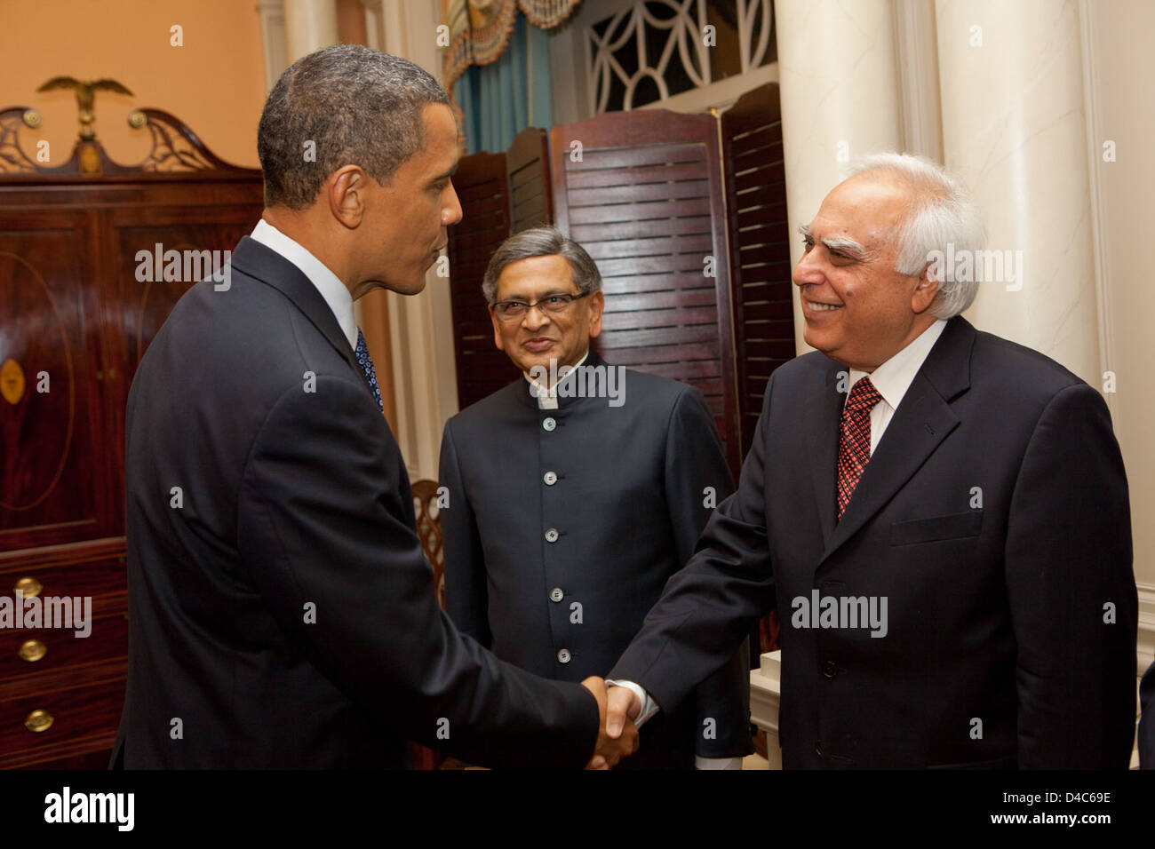 President Obama Shakes Hands With Indian Minister for Human Resource Development Shri Kapil Sibal Stock Photo