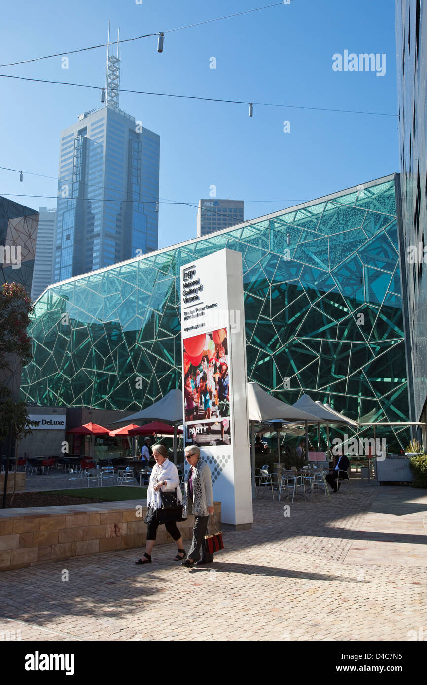 Iconic architecture of Federation Square with city skyline in background. Melbourne, Victoria, Australia Stock Photo